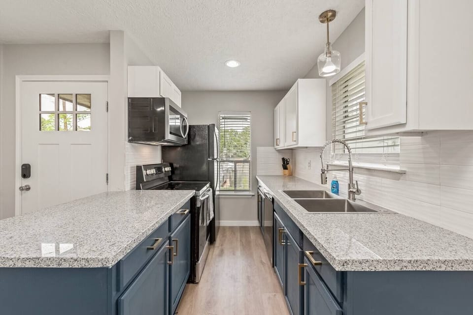 Stunning freshly renovated kitchen. NEW Granite counter tops, cabinets, fixtures AND appliances! 