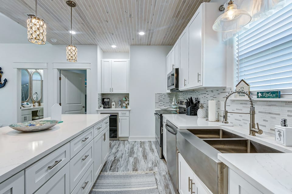 Brand new appliances! Coffee bar, wine chiller, beautiful sink w/ window views.