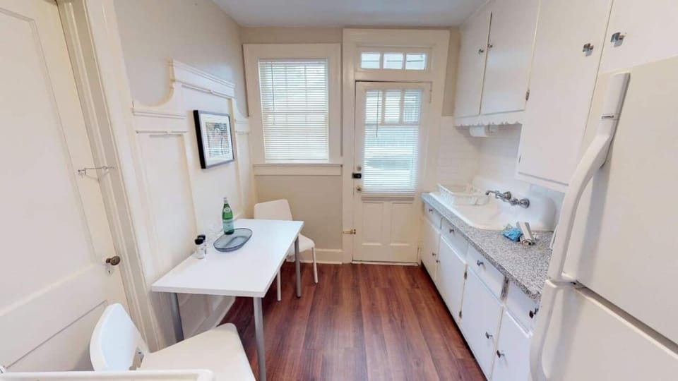 Kitchen with granite counter tops and Keurig coffee makers.  