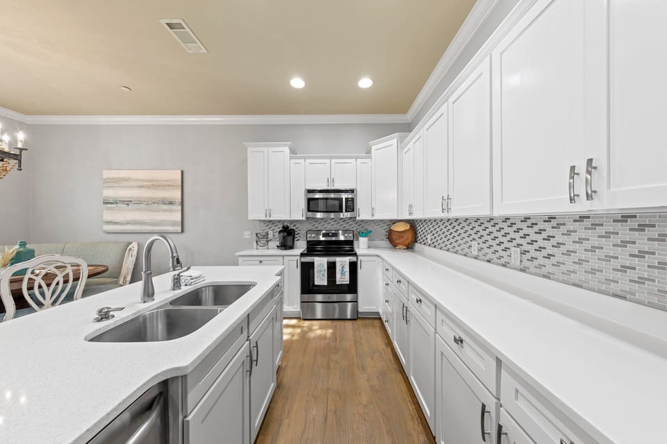 Fully stocked kitchen with stainless appliances and plenty of seating!