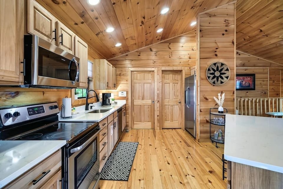 This kitchen is well stocked with everything you should need plus a large walk-in pantry and laundry room