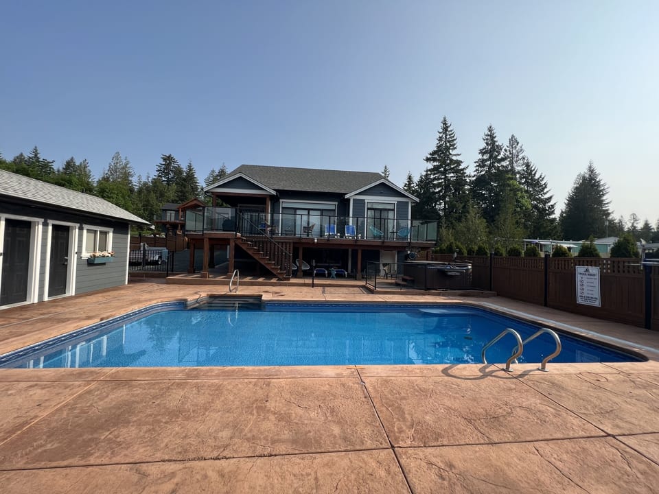 Poolside view of of the house and deck 