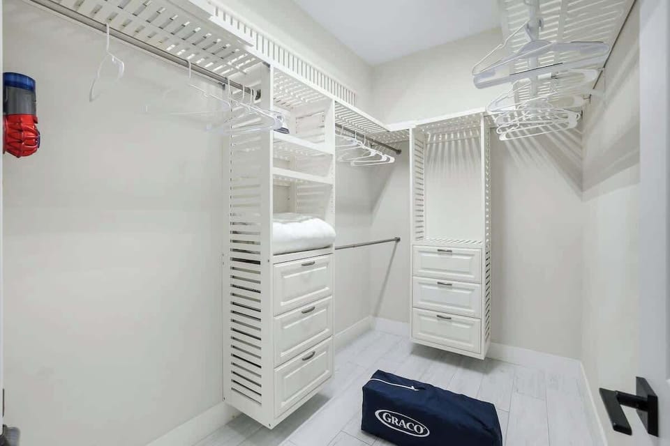 Our luxurious walk-in closet in our master bedroom for you to store some of your clothes during your stay equipped with a Pack & Play for your kids!