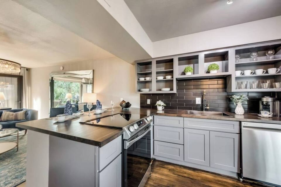 Spacious kitchen with sleek, modern appliances, fully equipped for all your cooking and dining needs.