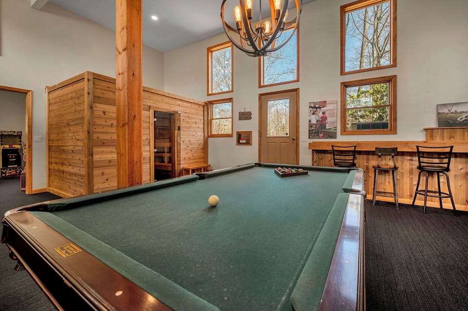 1,110 ft game room with pool table, sauna, arcade and poker table