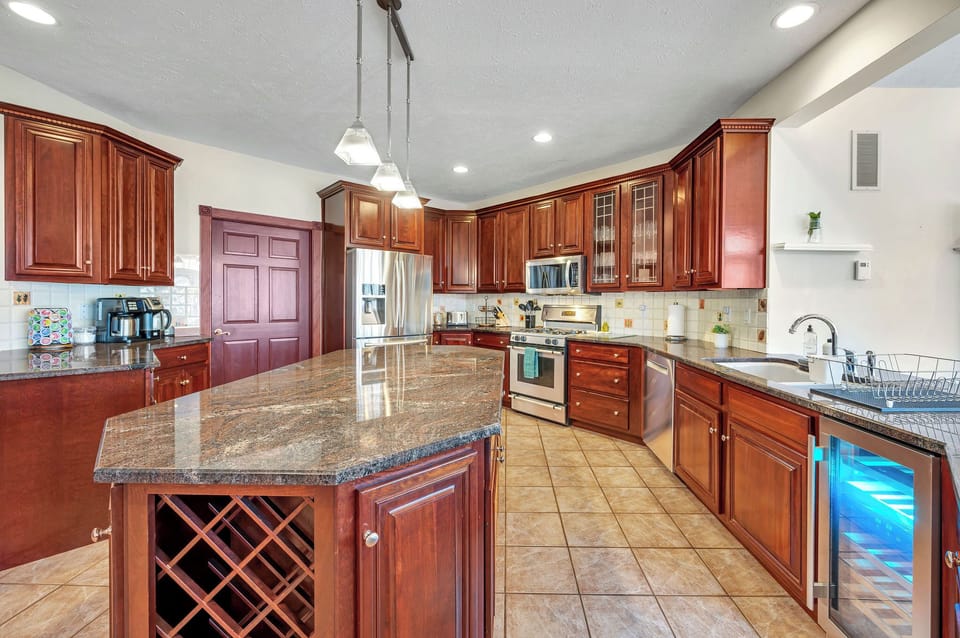 Wine fridge, coffee, tea, and lots of different serving utensils and cookware