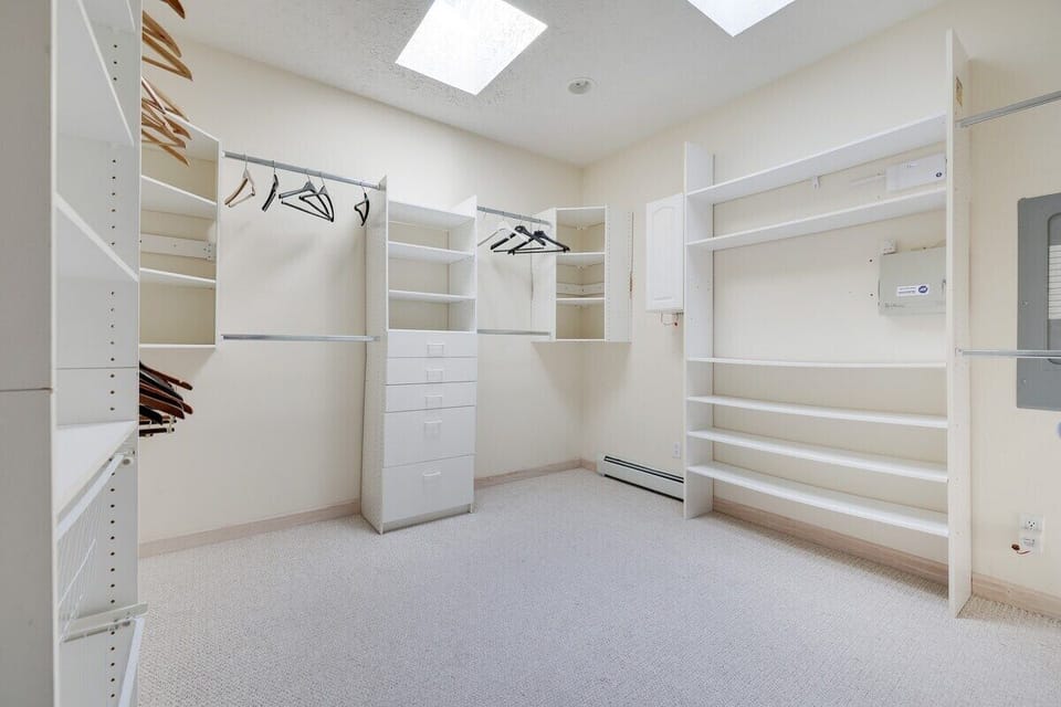 Walk-in primary bedroom closet 