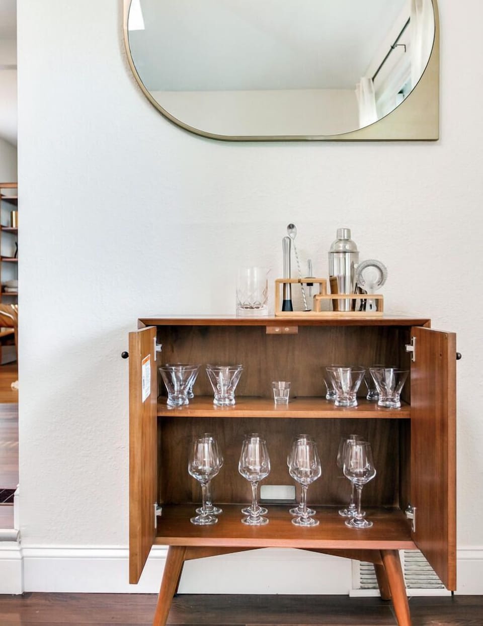 Bar cabinet with cocktail set, wine glasses and martini glasses