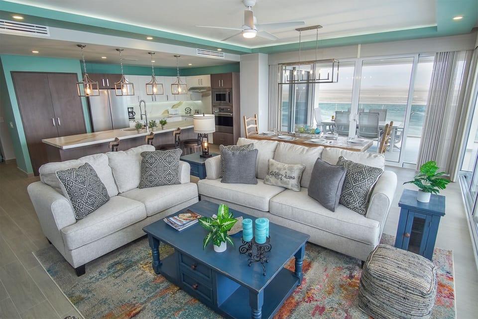 The seating area in the living room features comfortable sofas