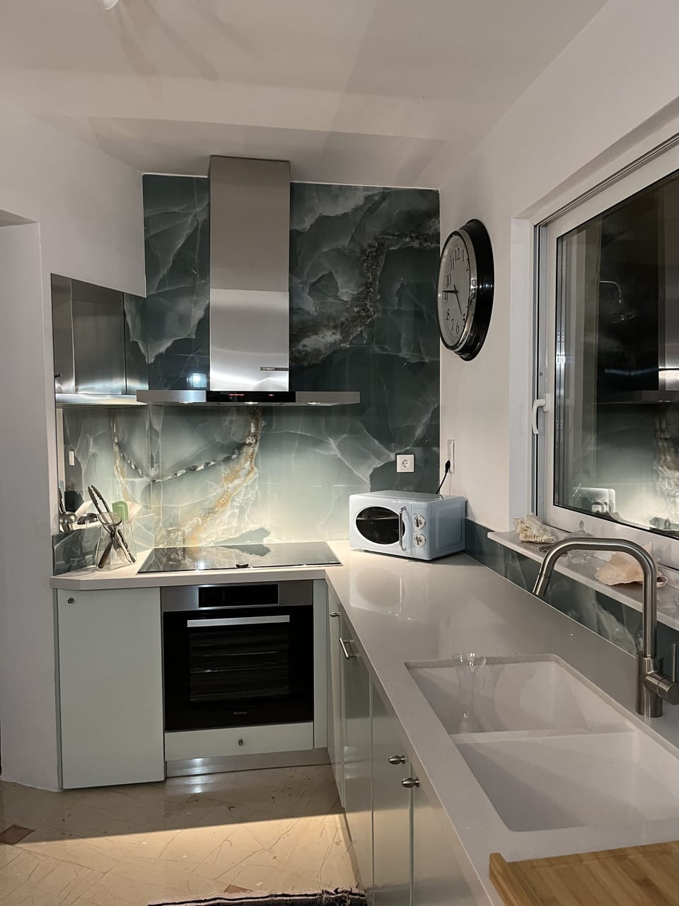 Spectacular kitchen with Belenco quartz countertops, custom cabinets and Neff, Miele, Bosch appliances. 