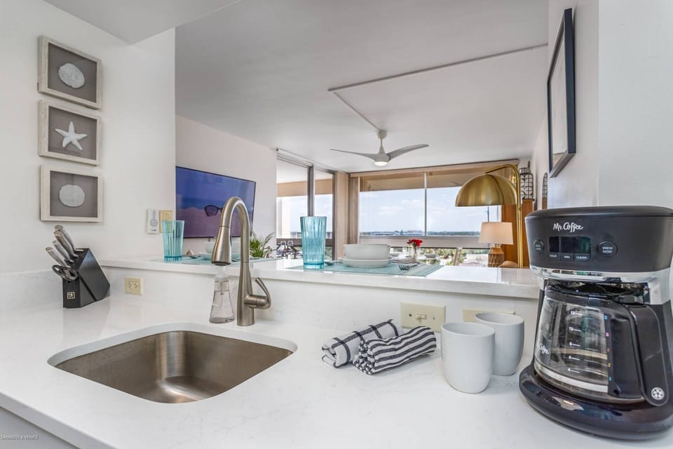 The modern kitchen is open to the main room.  Great views of the island!