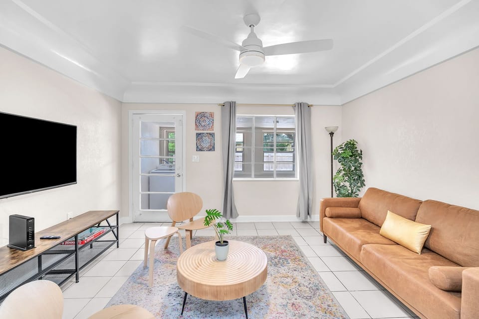 Living space is cozy and well lit with natural light.