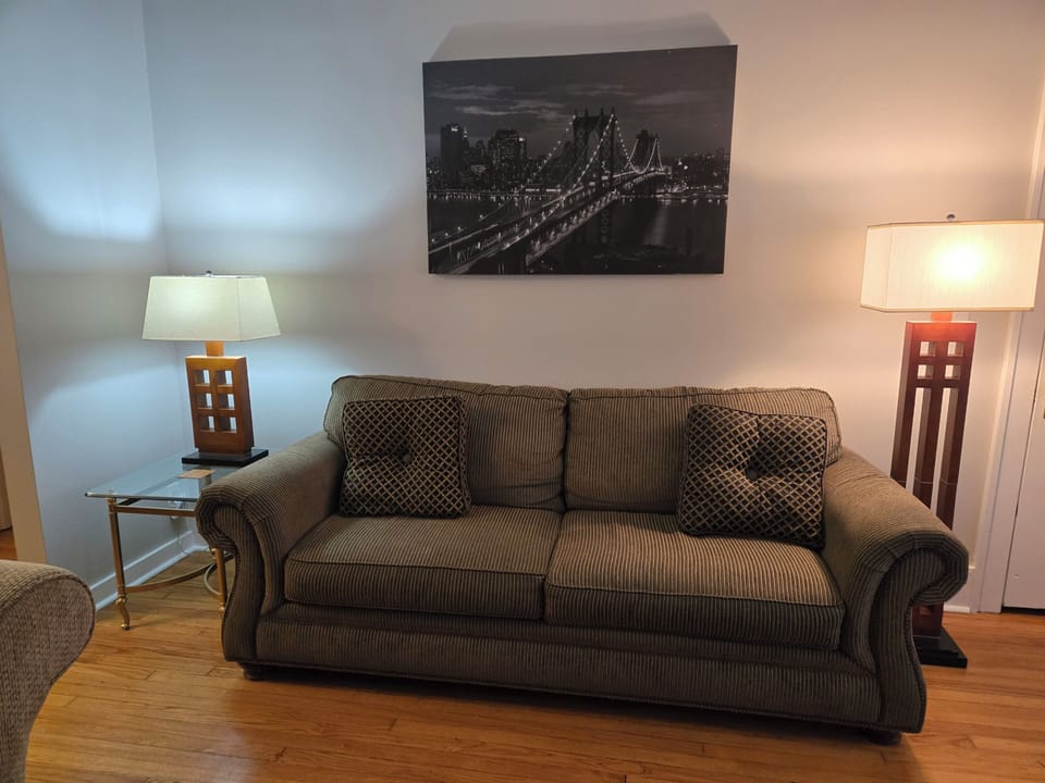 Another Living Room sofa for extra sleeping area. Bedding is provided for both.