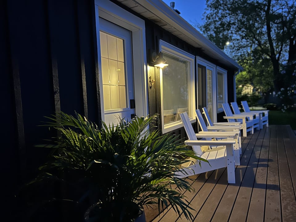 Relax out front at night and enjoy listening to the lake.