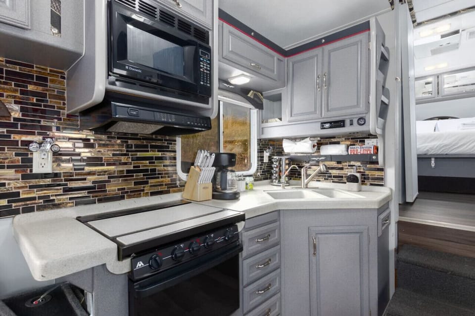Gourmet Kitchen: Whip up culinary delights in this stylish kitchen that is very well stocked!