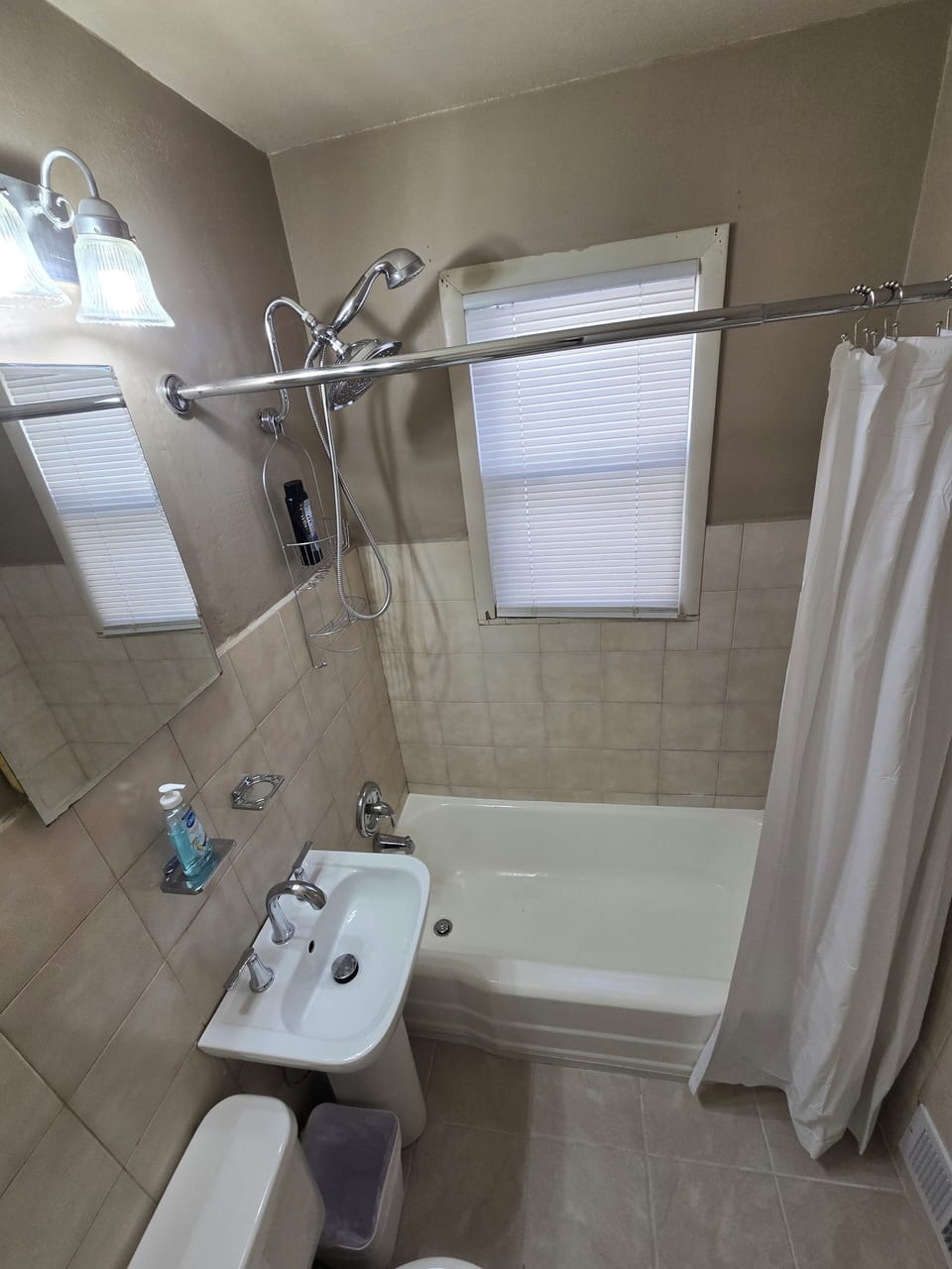 Main floor Bathroom located in hallway between Foyer and Kitchen. 