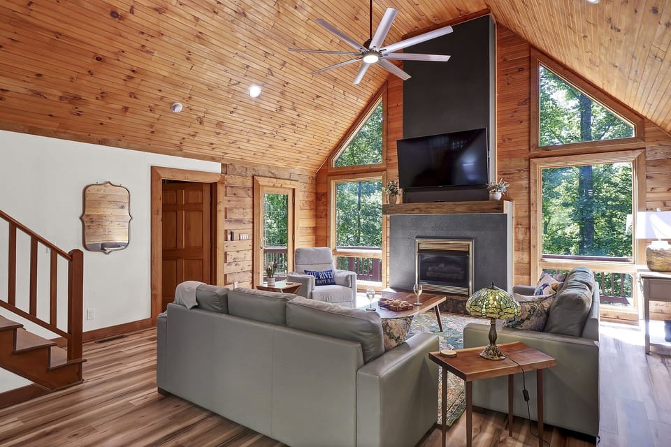 The sunlit family room offers an inviting space that is perfect for relaxing, playing games, or enjoying time together.