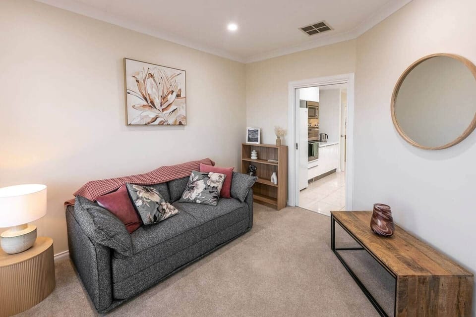 Downstairs sitting room 
Koala cushy sofa bed (can be made up for additional guests)
Gorgeous beach & sunset views
Reverse cycle heating & cooling
Smart TV - Sony Bravia 50 inch