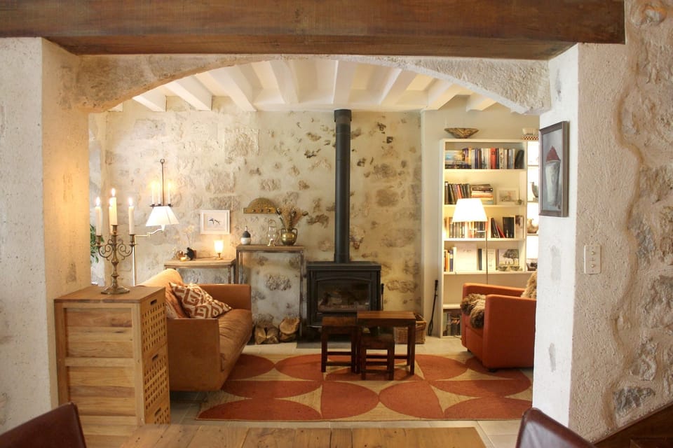 living room with TV and wood stove