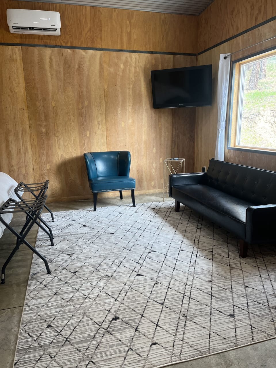 Vinyl Sofa and Leather chair.  TV 40" HD.