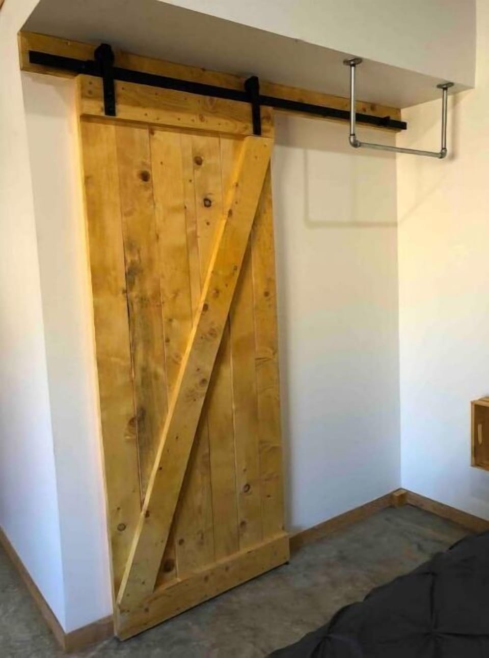Sliding barn door to bathroom area.