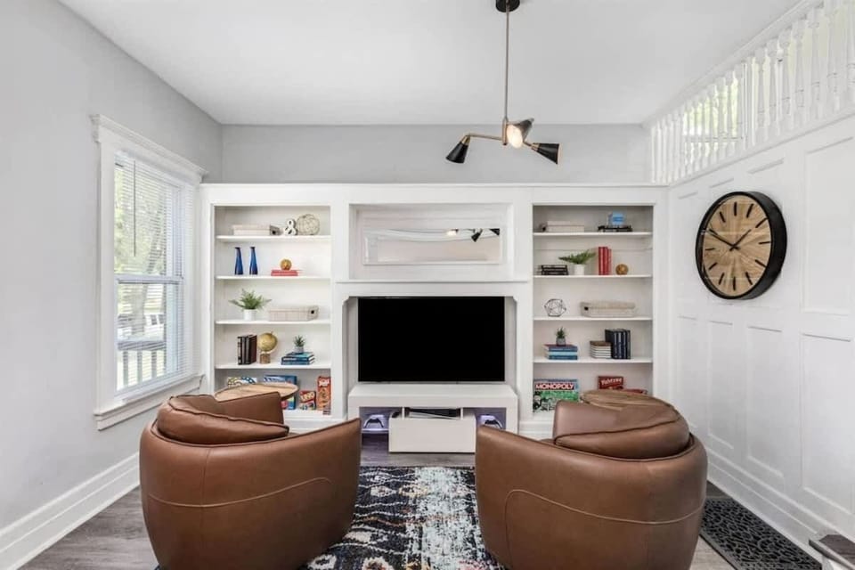 Second sitting area with built-in shelves and reading nook.