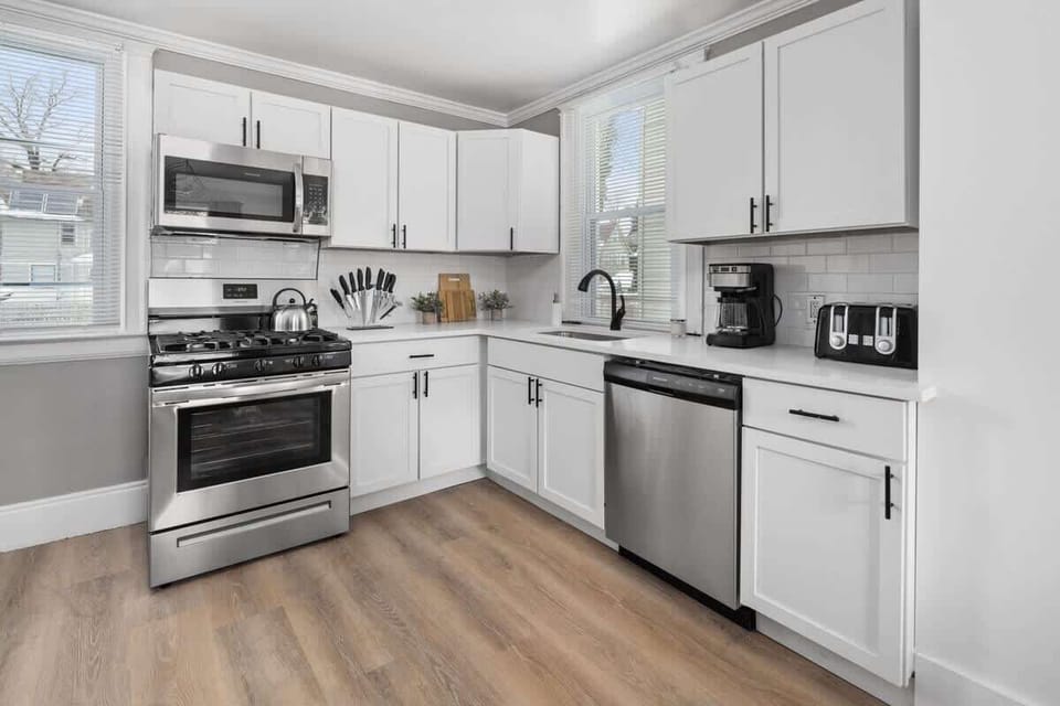 Modern kitchen with stainless steel appliances and ample counter space.
