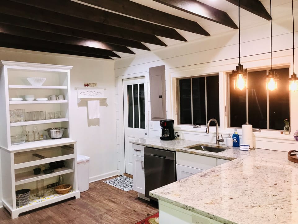 Kitchen has it all, wine glasses to waffle iron!