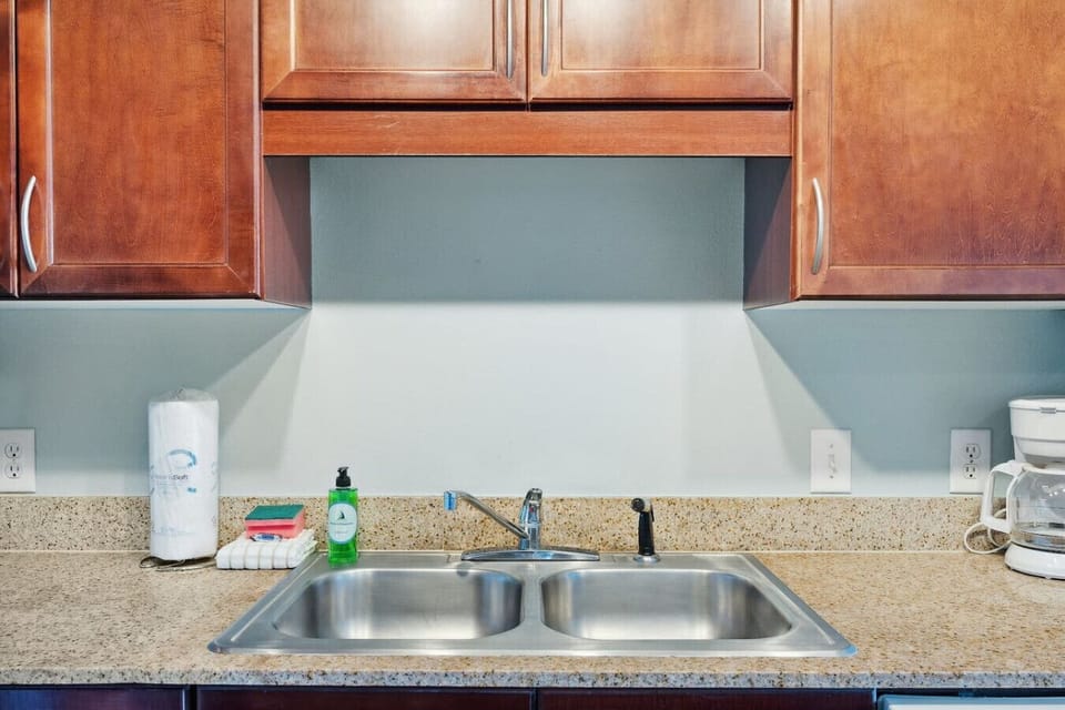 Open Concept, Fully Stocked Kitchen with Drip Coffee Maker and Island Bar Seating