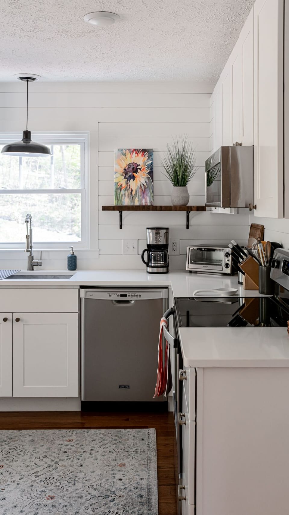 Well equipped kitchen with stainless steel appliances.