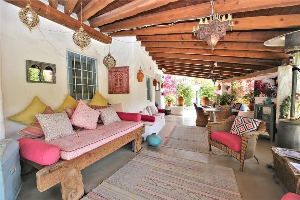 First terrace with seating area, outdoor TV and dining area