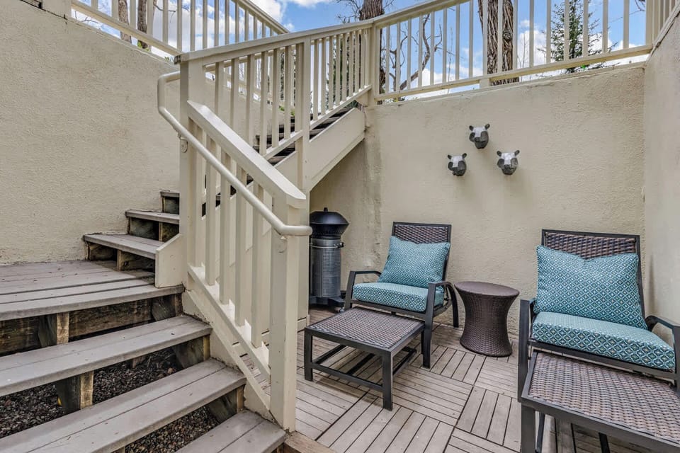 Private outdoor patio with outdoor furniture and grill