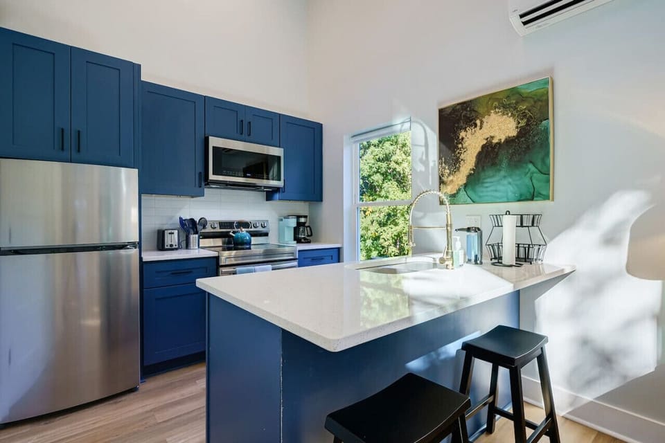 Gold Rush Tiny Home Kitchen is fully stocked with pots, pans, bake wares, utensils, cutlery and dishes.