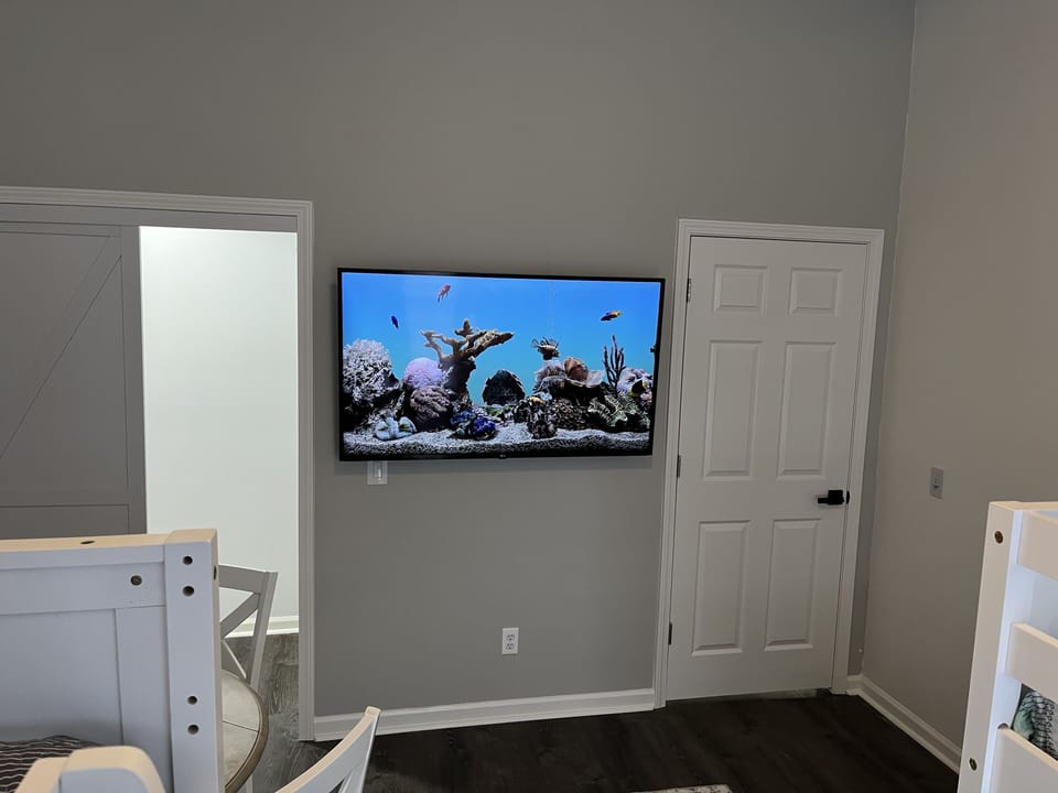 Bedroom #6 featuring a 55” Smart TV