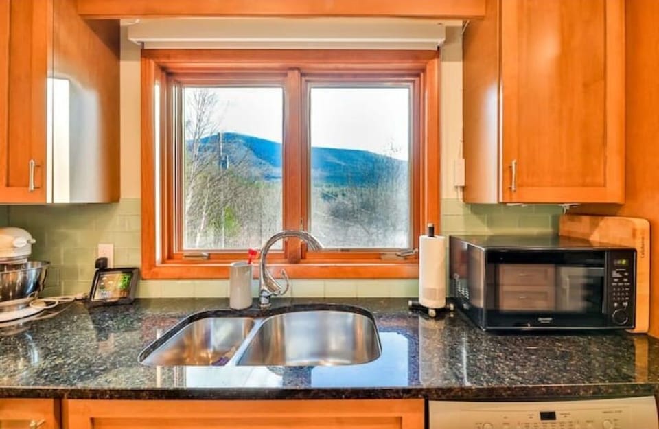 view of the mountains from kitchen sink
