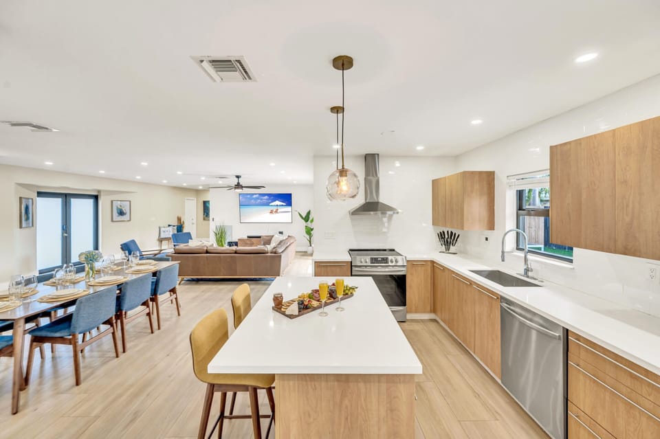 The kitchen comes with sleek countertops, modern appliances and bar seating for two people.