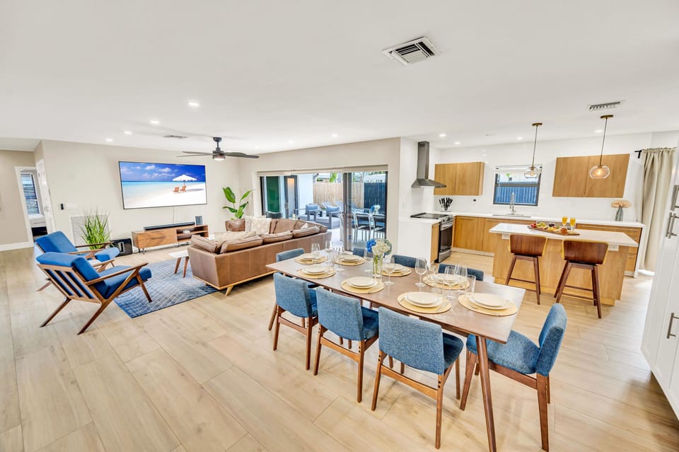 The dining room with its floor to ceiling windows offers garden views while letting in the year-round Florida sun.
