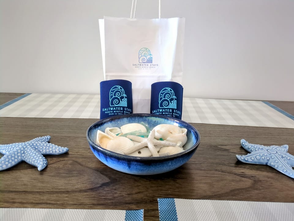 Who doesn't love a good koozie for the beach! Ask about our welcome kit.
