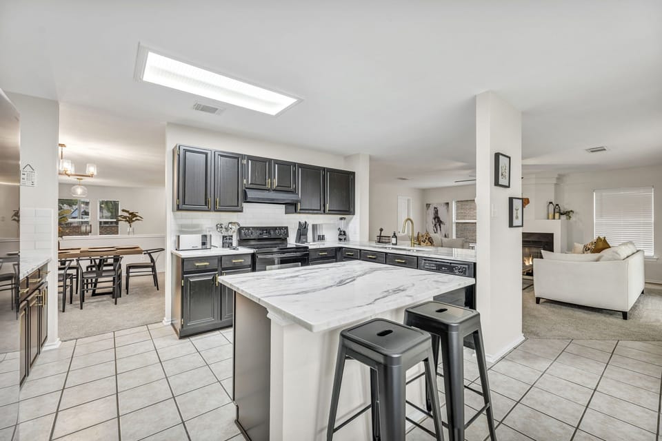 Kitchen island with tall bar stools.