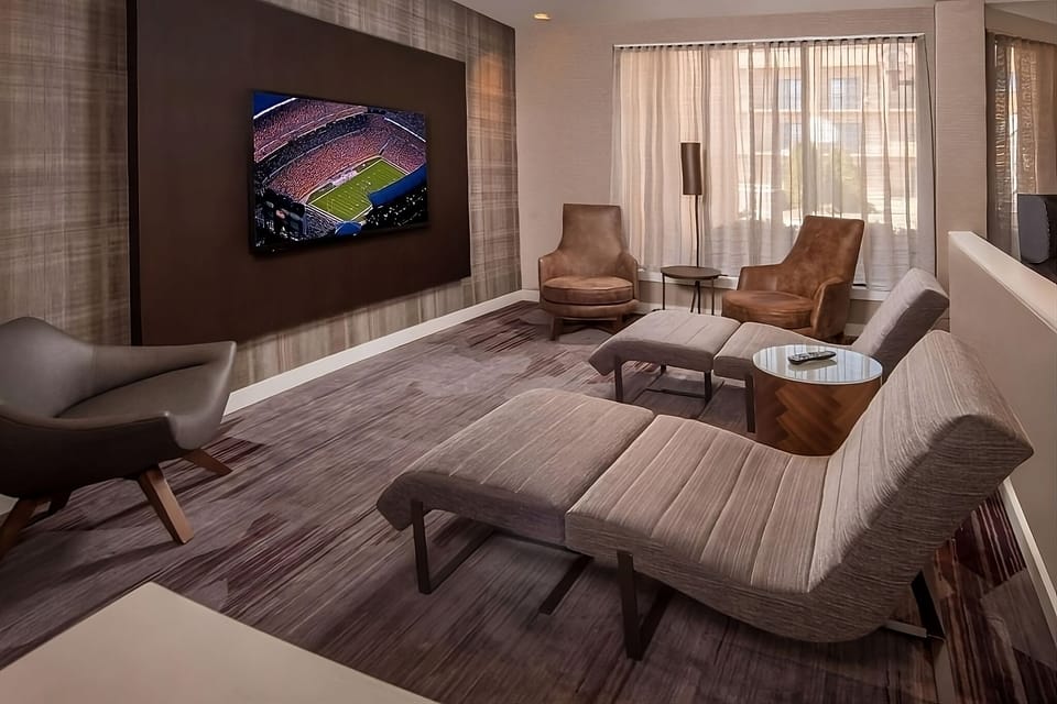 Unwind on plush lounge seating with big-screen entertainment.