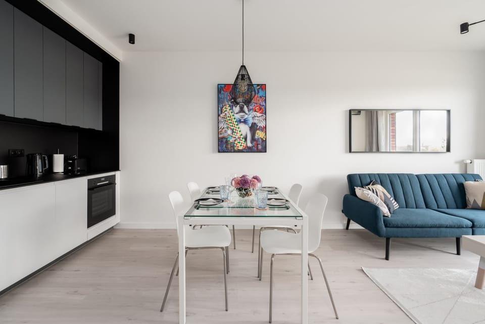 Another angle of the dining and living area, highlighting the open-plan layout and tasteful furnishings.
