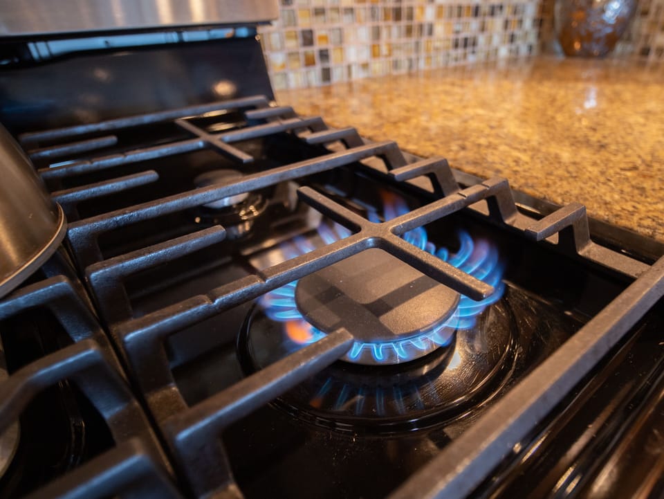 Fully equipped kitchen with a sleek gas cooktop.