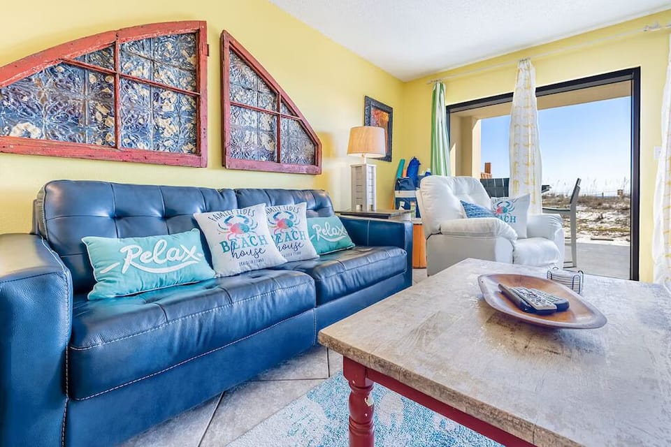 Surf Dweller #111 Living Room - NEW leather sleeper sofa - queen sized bed. NEW white leather rocker/recliner.