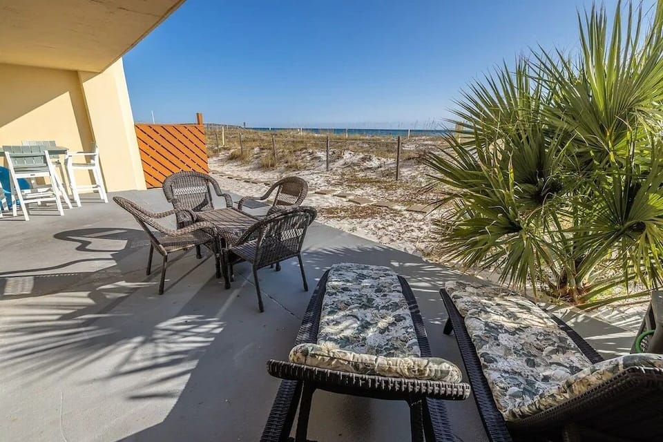 Surf Dweller #111 Patio - Private patio! Raised table / 4 chairs, 2 loungers, seating for 4, & baby pool.