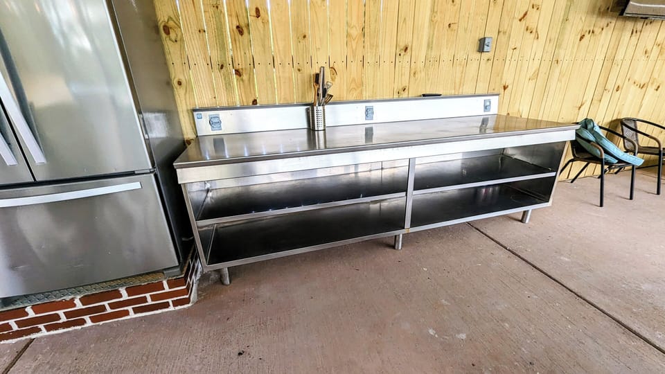 Huge Stainless steel table; great to prepare food or set up a buffet style area