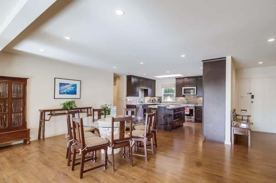 Full view of the dining area, kitchen, and island