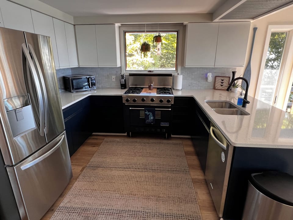 Kitchen with new fridge and air fryer/toaster oven/microwave combo
