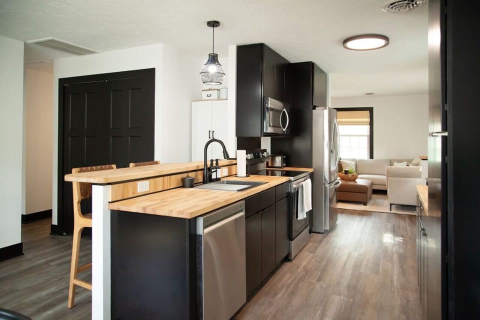 Cook, connect, and create memories in this stunning kitchen with stainless-steel appliances, open layout, and warm butcher block counters. Perfect for shared meals and morning coffee.