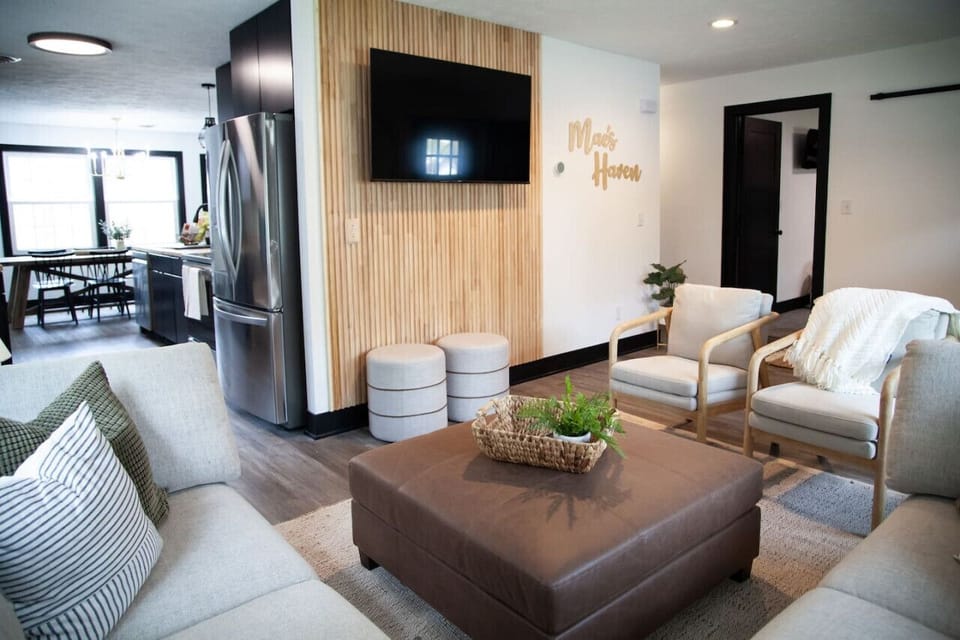 Unwind in this beautifully styled lounge featuring a smart TV, warm wood accents, and a relaxed, contemporary vibe. Designed for gathering, conversation, and connection.