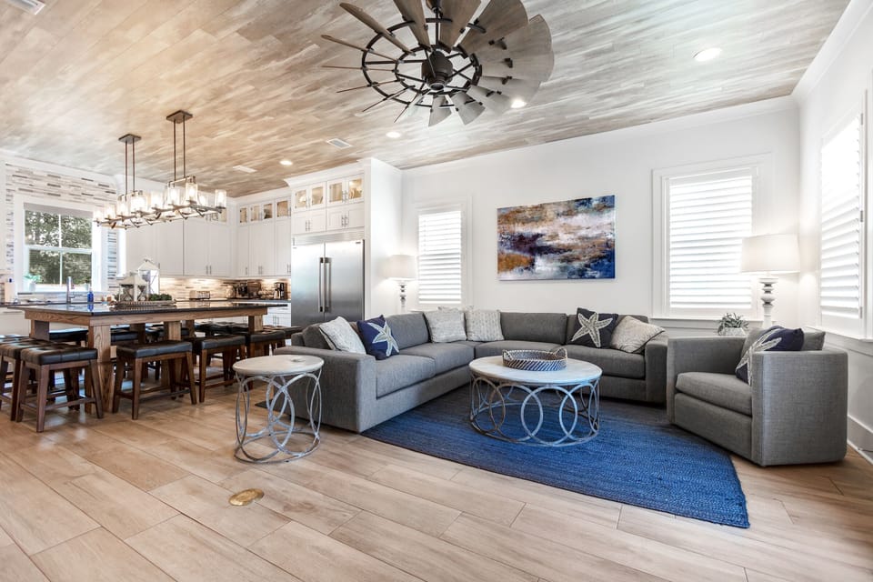 Open living room/kitchen with large TV